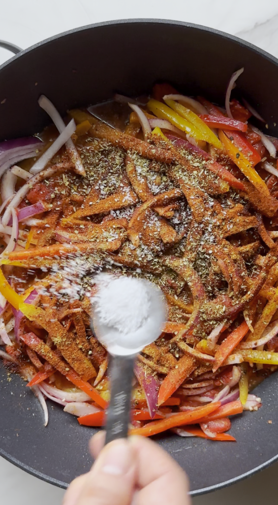 seasonings going into the chicken fajita pasta